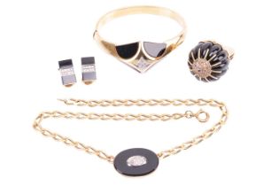 An onyx and diamond set necklace, bangle, ring and earring suite. The necklace is set with an onyx