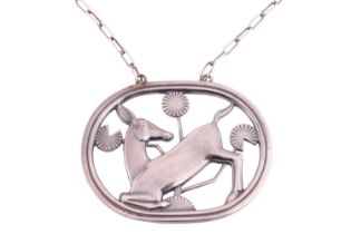 Georg Jensen - a necklace with kneeling fawn and flowers, attached to a cable chain and toggle