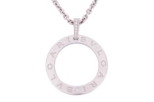 Bulgari - an 18ct white gold and diamond set pendant and chain. The circular Bulgari pendant is