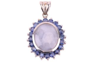 A star sapphire halo pendant; comprising a pale sapphire oval cabochon measures 16.6 x 14.0 x 5.5