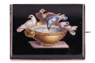A Victorian micromosaic brooch featuring the Doves of Pliny, depicted in coloured tesserae to a
