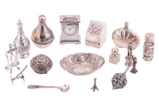 A collection of miniature silver pieces comprising four silver perfume bottles, a silver pin tray, a