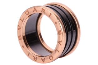 Bulgari - an 18ct rose gold and ceramic B Zero ring. The four-band ring is set with a black