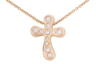 A diamond set cross pendant and chain, by Elsa Peretti for Tiffany & Co. Set with 0.20cts of round