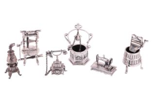 Six silver and white metal miniatures comprising a silver mangle on a half barrel tub with three