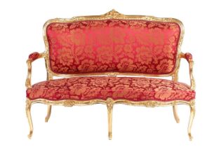 A 20th century Louis XV-style canape settee, with carved and molded wood and gilt gesso outline,