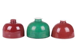 A Chinese peach bloom red glazed porcelain "Beehive" water coup with a white interior and exterior