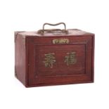 A Chinese rosewood-cased mahjong set with bone and bamboo tiles the sliding door bearing the word