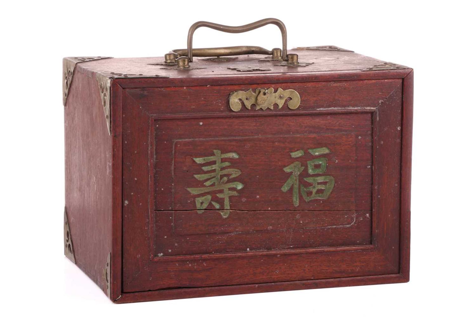 A Chinese rosewood-cased mahjong set with bone and bamboo tiles the sliding door bearing the word