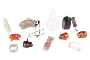 A small collection of Chinese carved jade items including a celadon jade archer's ring, a small