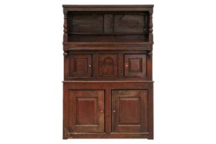 An 18th century Wesh oak Cwpwrdd Tridarn cupboard with open hutch top over a middle tier of shaped
