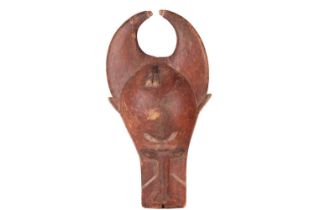 A Baule people wooden helmet animal mask (Bo Nun Amuin) with curved horns and signs of polychromic