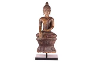 A Siamese carved and giltwood, seated Buddha in Bhumisparsha, 18th century, with flame ushnisha,