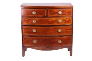 A George III crossbandend bowfronted chest of drawers, fitted two short over three long drawers with