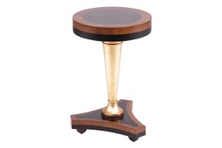 Soher, a contemporary circular pedestal table with cross banded blackwood ebony top, supported on