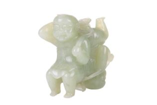 A large Chinese green jade carving of two laughing Buddhai, each figure supported on the back of his