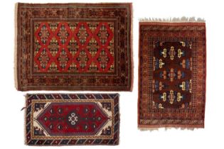 A red ground Turkoman rug with rows of composite guls within reciprocal arrow head borders, 172 cm x