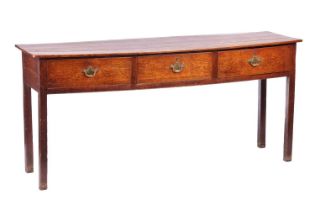 A 19th-century Welsh borders oak dresser base, with quartered planked top over three short