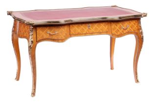 A 20th century Louis XV style cartouche topped bureau plat with tooled leather insert, gilt metal