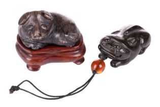 A Chinese dark green jade toggle in the form of a corpulent tiger thought to be Tang Dynasty, (618