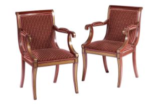 A pair of 20th century mahogany effect Regency style scroll arm elbow chairs with faux inlaid, stuff