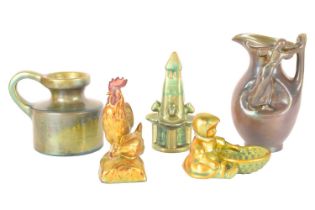 A collection of five small Zsolnay ceramic lustre items, consisting of a figural jug, 17cm high, a