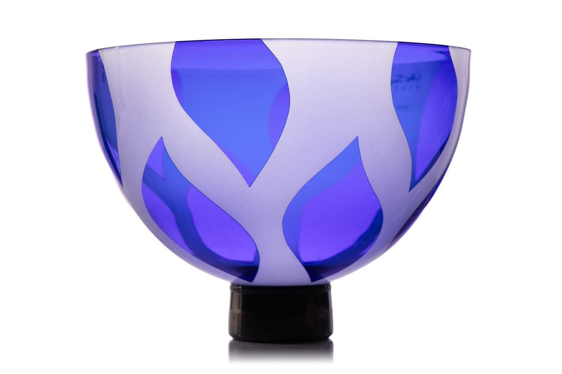 A Gillies Jones art glass bowl, with translucent blue leaf decoration on a circular foot, etched