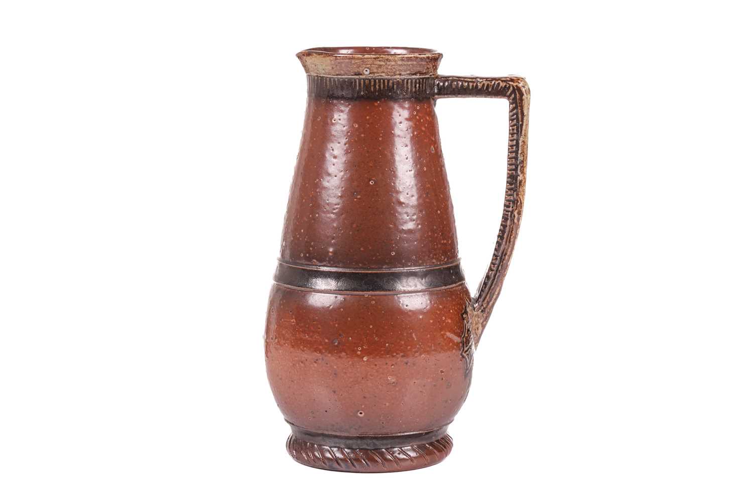 A late 19th-century Martin Brothers salt-glazed jug, by Robert Wallace Martin, of traditional form