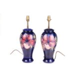 A pair of Moorcroft large baluster-form lamp bases, in the Anenome pattern, tube-lined decoration on