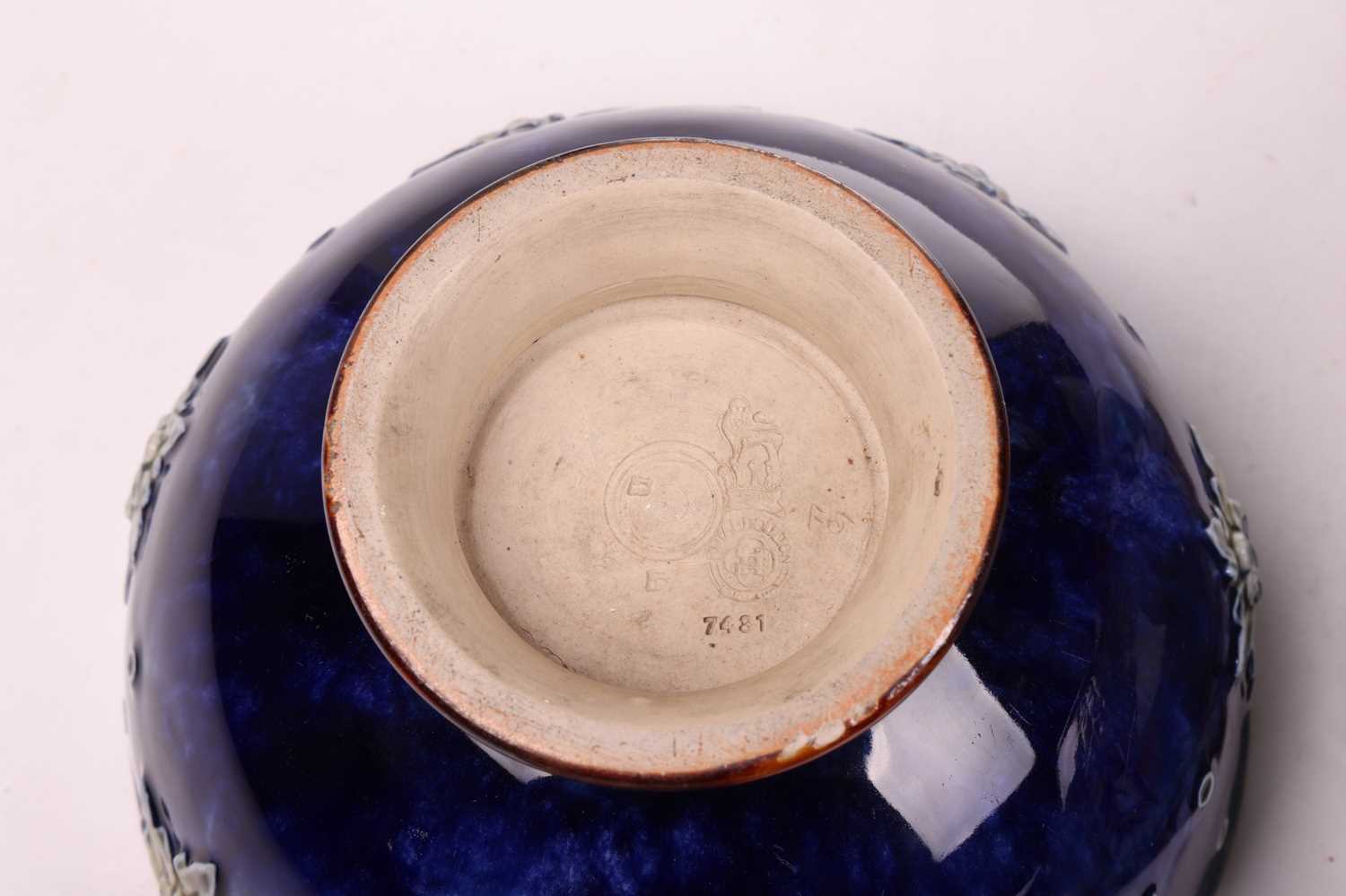 An early 20th-century Royal Doulton open bowl, shape number 7562, mythical beast decoration to the - Image 7 of 8