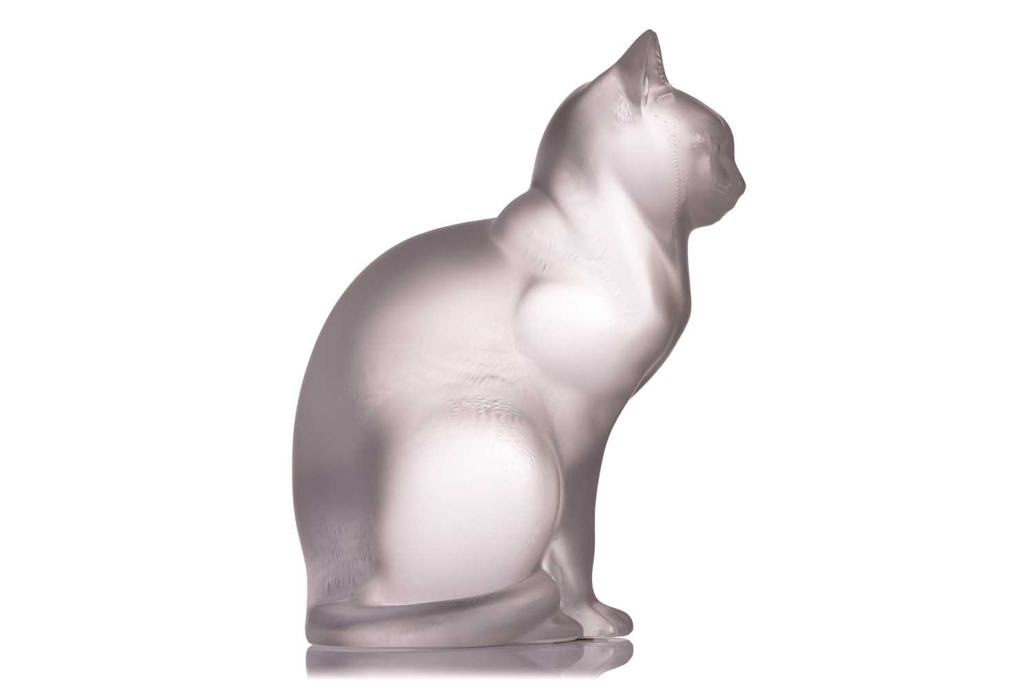 A Lalique frosted glass model of a seated cat, engraved mark 'Lalique France', 21 cm high. Chip