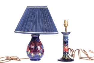 A Moorcroft table lamp, in the Anenome pattern, tube-lined decoration on a dark blue ground,