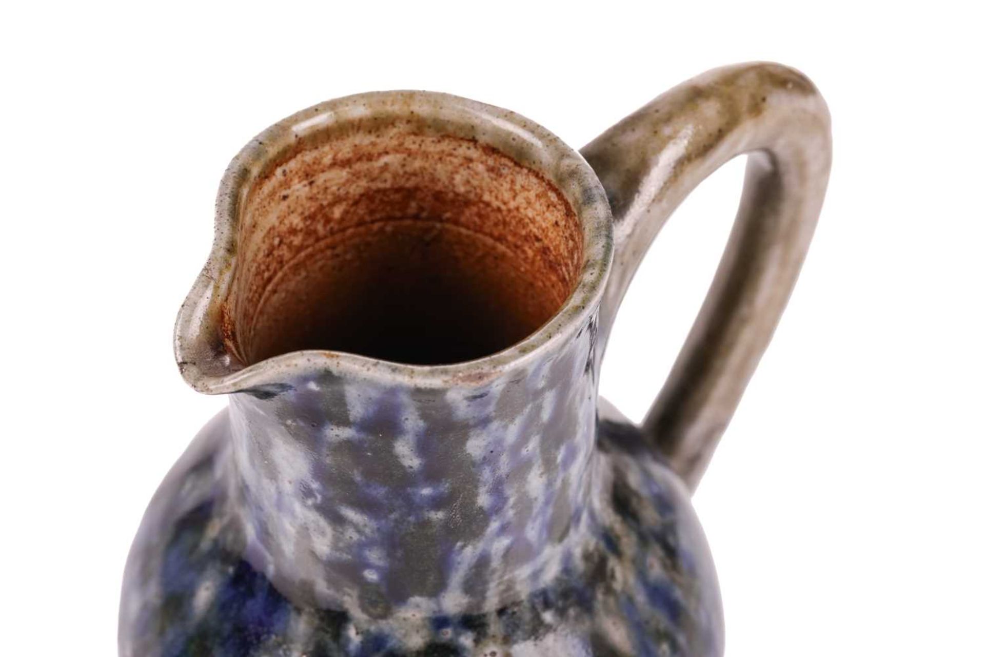 A late 19th century Martin Brothers stoneware jug, of bellied form with mottled blue glaze on a - Image 2 of 12