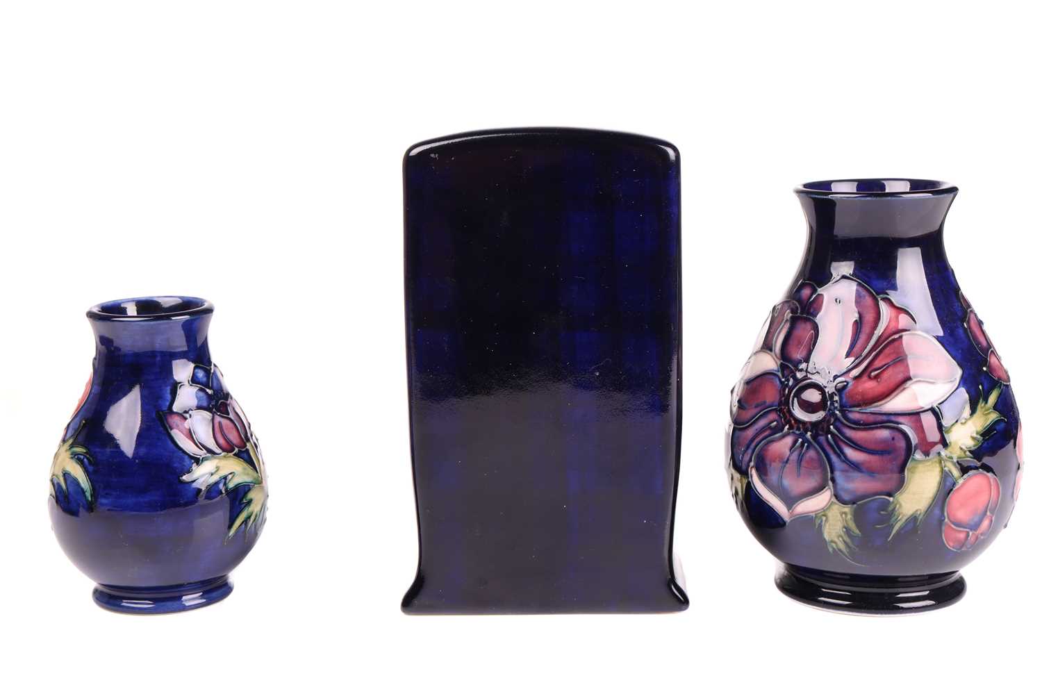 A collection of small Moorcroft items in the Anenome pattern, tube-lined decoration on a dark blue - Image 3 of 5