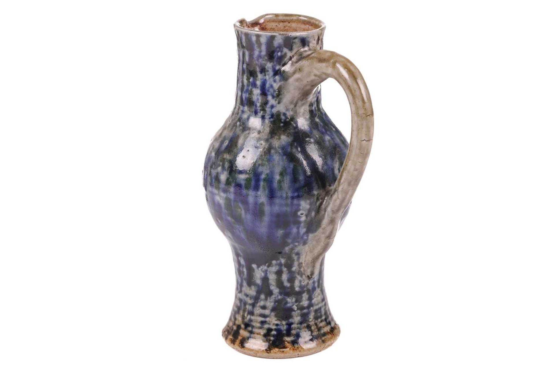 A late 19th century Martin Brothers stoneware jug, of bellied form with mottled blue glaze on a - Image 4 of 12