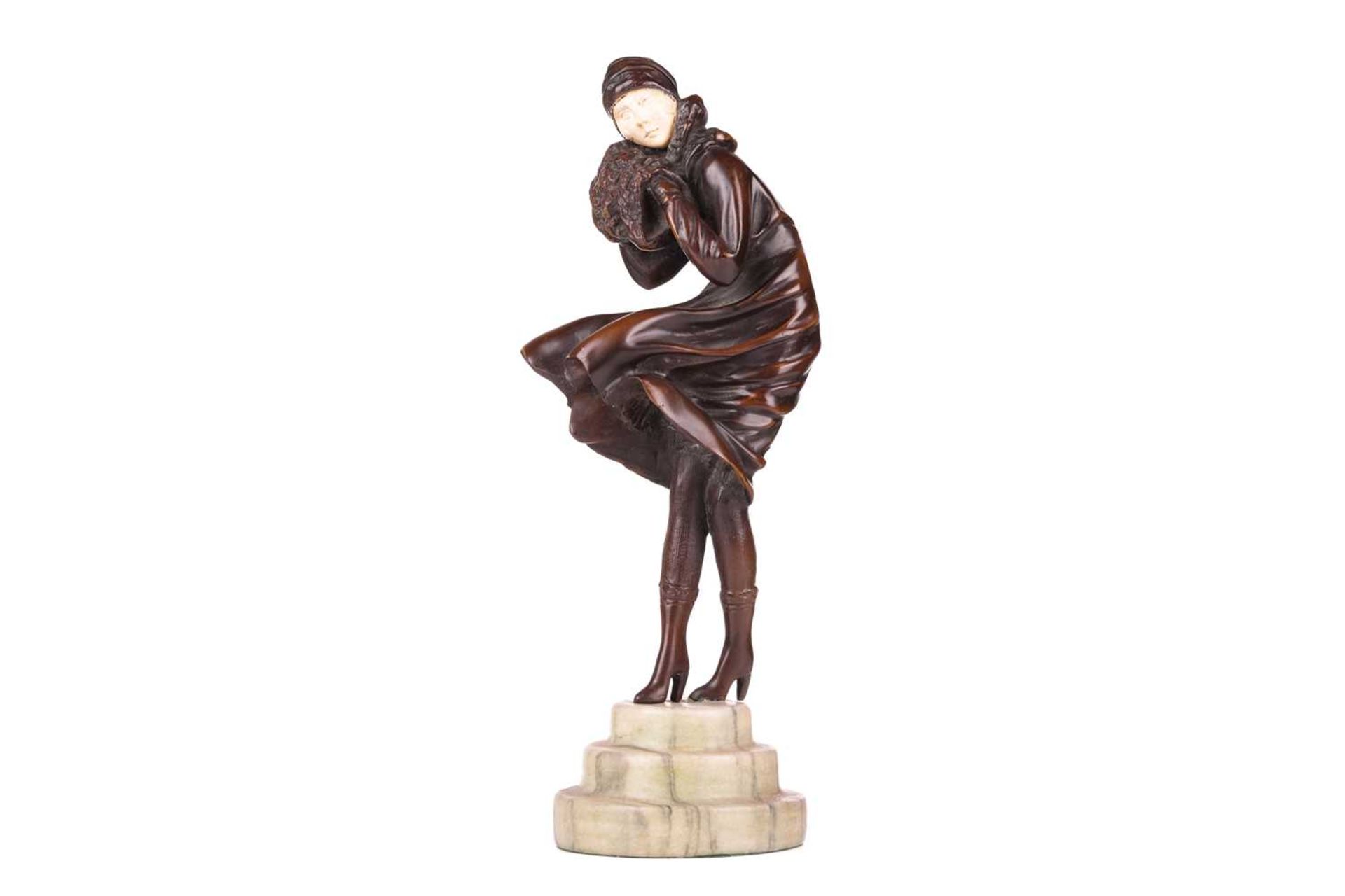 Manner of Demetre Chiparus (1886-1947), an Art Deco style patinated bronze figure of a lady