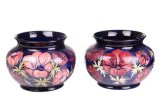 A pair of Walter Moorcroft large jardinieres, in the Anenome pattern, tube-lined decoration on a