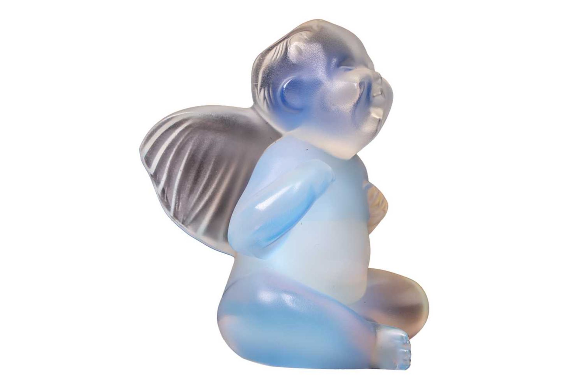 A contemporary Lalique opaline crystal glass paperweight, modelled as a seated cherub / putti, 7.5 - Image 4 of 6