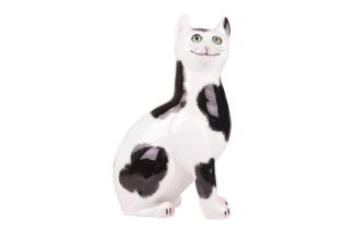 A large Wemyss ceramic cat, 20th century, the seated animal with glass eyes and sponged black