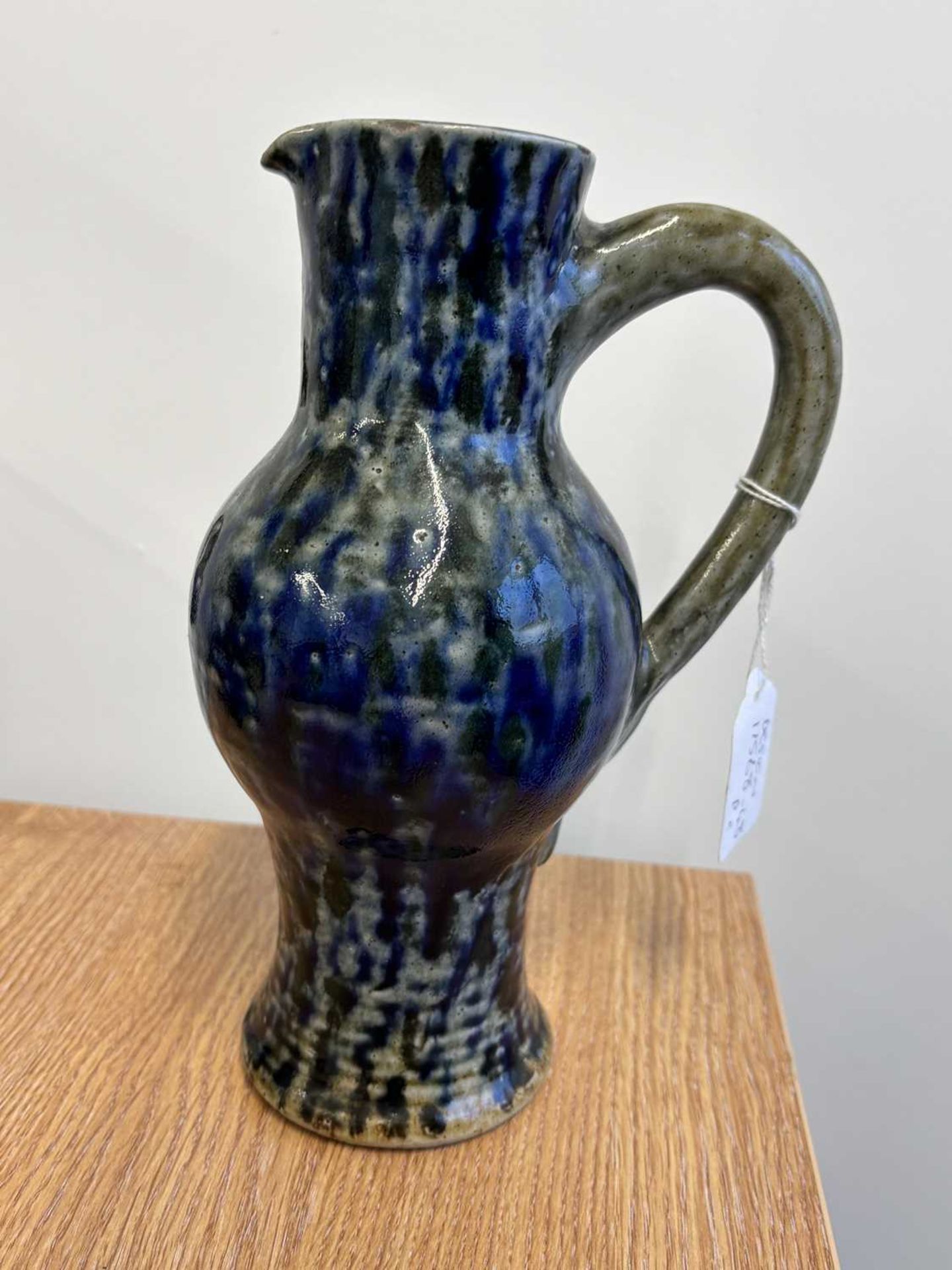 A late 19th century Martin Brothers stoneware jug, of bellied form with mottled blue glaze on a - Image 11 of 12
