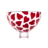 A Gillies Jones art glass bowl, with red heart decoration on a circular foot, etched signature to