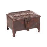 An Arts and Crafts Newlyn copper table box by John Pearson, of rectangular form on four feet, with