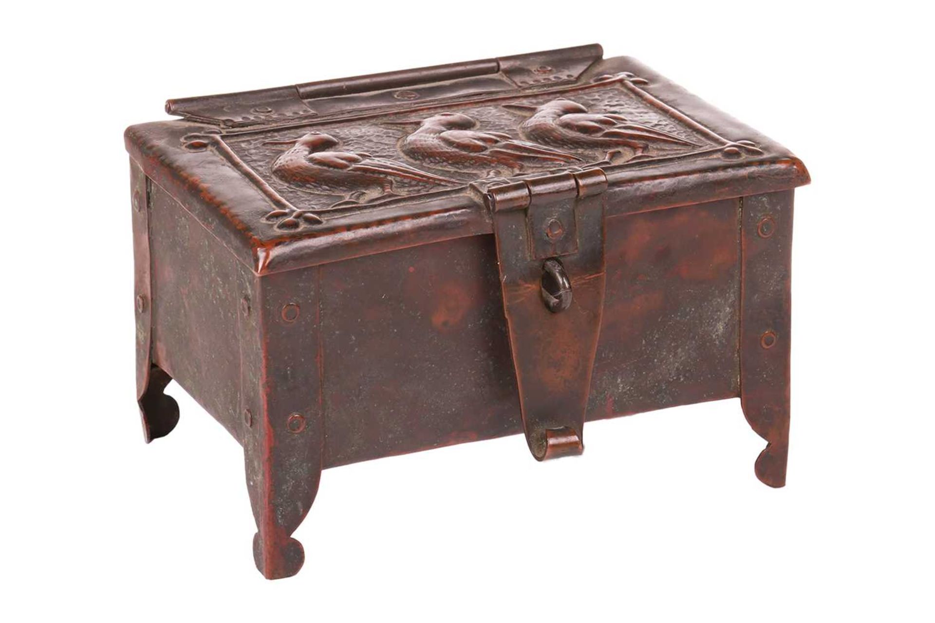An Arts and Crafts Newlyn copper table box by John Pearson, of rectangular form on four feet, with
