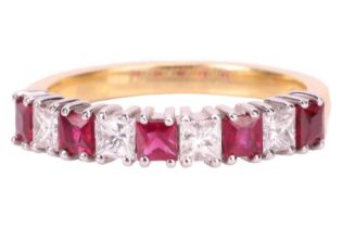 A ruby and diamond half-eternity ring in 18ct gold, comprising princess-cut rubies with an estimated