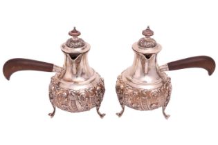 A pair of Edwardian silver Cafe Aut Lait pots, London 1904 by Goldsmiths Company, each with hinged