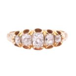 An old cut diamond five stone ring, set with a graduated row of cushion shape old cut diamonds with 