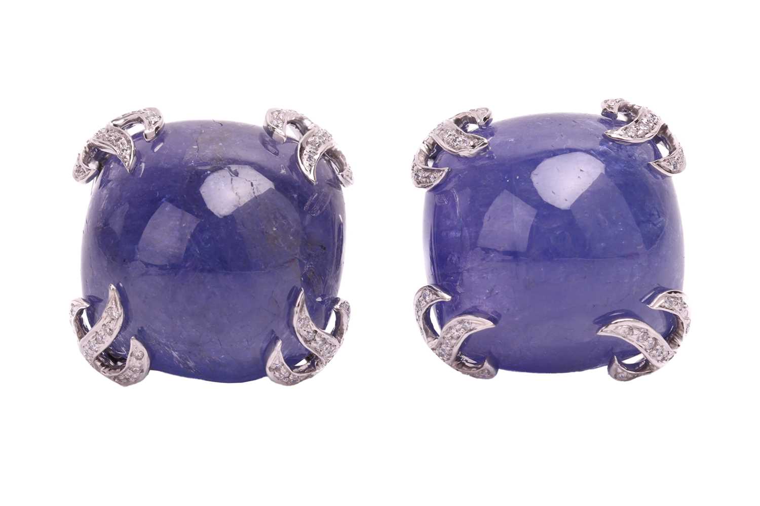 A pair of tanzanite and diamond earrings, each set with a cabochon tanzanite measuring 16 x 16 x 9.6