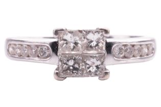 A princess-cut diamond cluster ring, with four princess-cut diamonds illusion-set together, giving