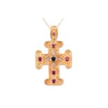 A gem-set cross pendant on chain, containing circular-cut rubies and sapphires along with diamond ac
