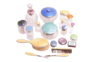 Nineteen silver and enamel dressing table appointments and dressing accoutrements, including a